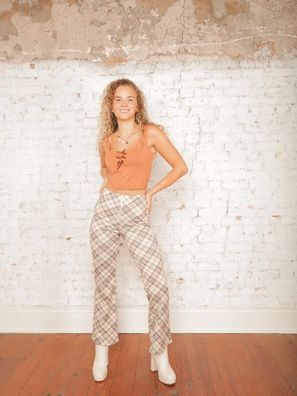 Button-front trousers – Trousers that feature a row of buttons along the waistband for a stylish detail.Button-front trousers – Trousers that feature a row of buttons along the waistband for a stylish detail.Caledonia Plaid Flare Pants