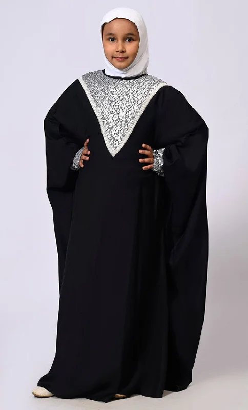 Hoodie with pockets – Hooded sweatshirt that includes a kangaroo pocket or side pocketsHoodie with pockets – Hooded sweatshirt that includes a kangaroo pocket or side pocketsSequin Sparkle: Stylish Girl's Black Rayon Kaftan With Sequin detailings